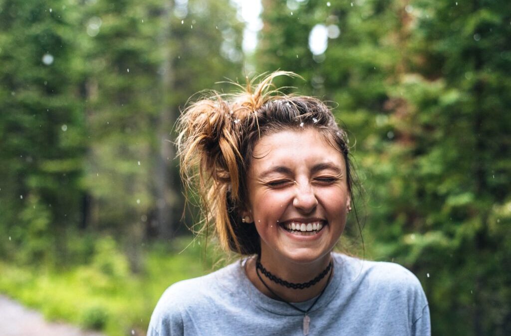 Smiling young woman in the woods