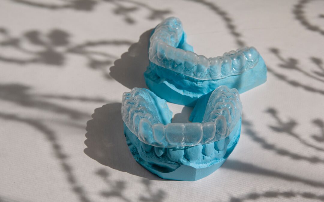 Dental casts with Invisalign trays placed on top