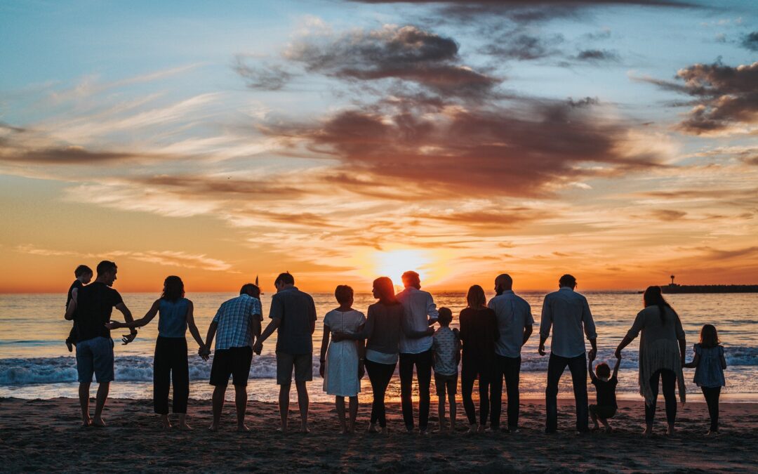 Large family gathers on the beach