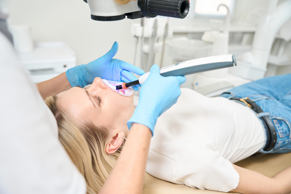 dentist using intraoral camera on patient