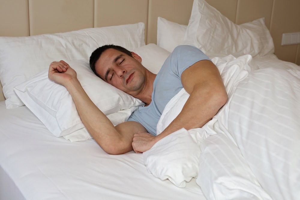 Man sleeping peacefully after choosing an oral appliance for sleep apnea