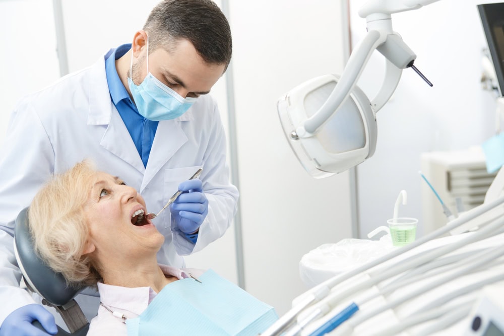 Older woman relaxing in a dental chair