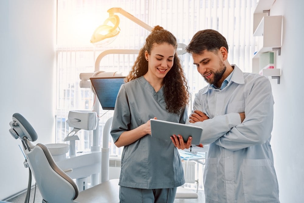 Hygienist explaining a deep cleaning to a patient